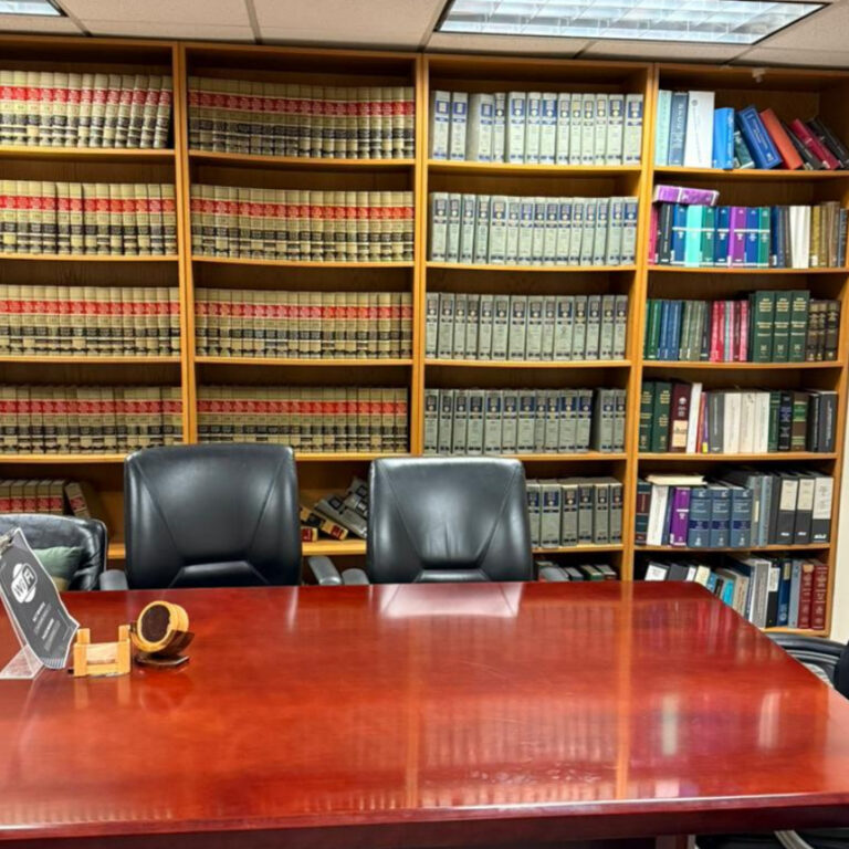 Sharping Law conference room with legal library