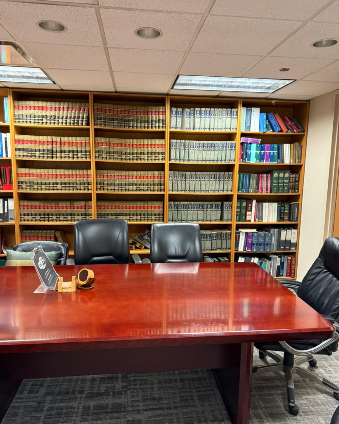 Sharping Law conference room with legal library