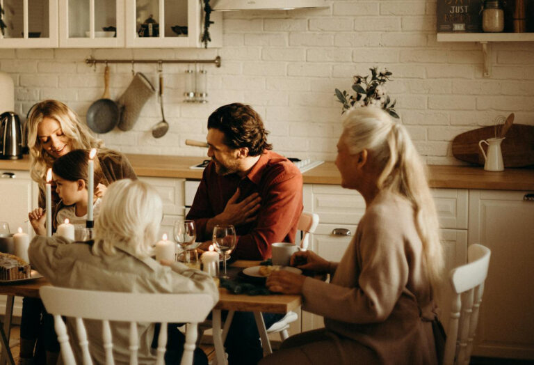 Adult child speaking with elderly parent